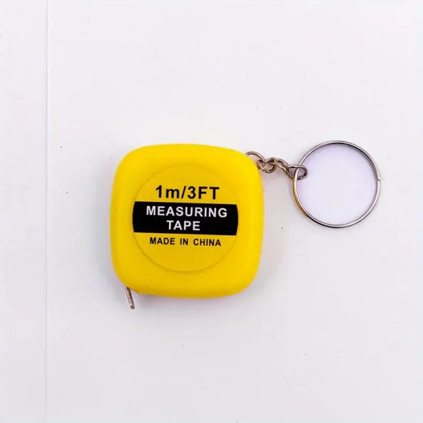 A yellow measuring tape with the words " 1 m 3 ft " on it.