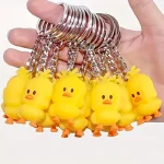 A hand holding a bunch of rubber ducks