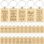 A bunch of wooden keychains with sayings on them