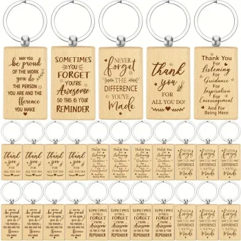 A bunch of wooden keychains with sayings on them